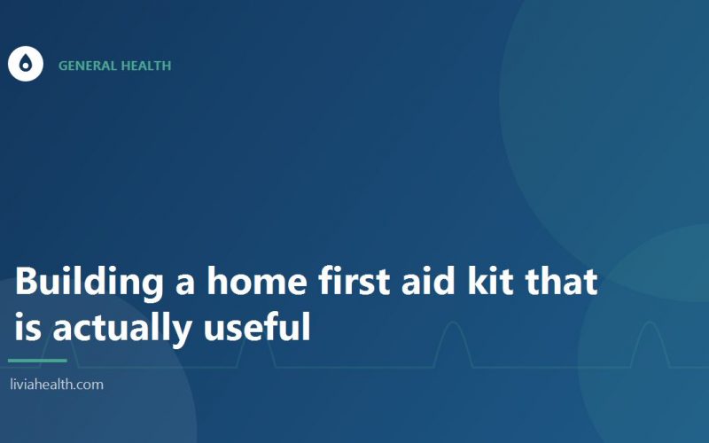 Open first aid kit with bandages and antiseptic on a table