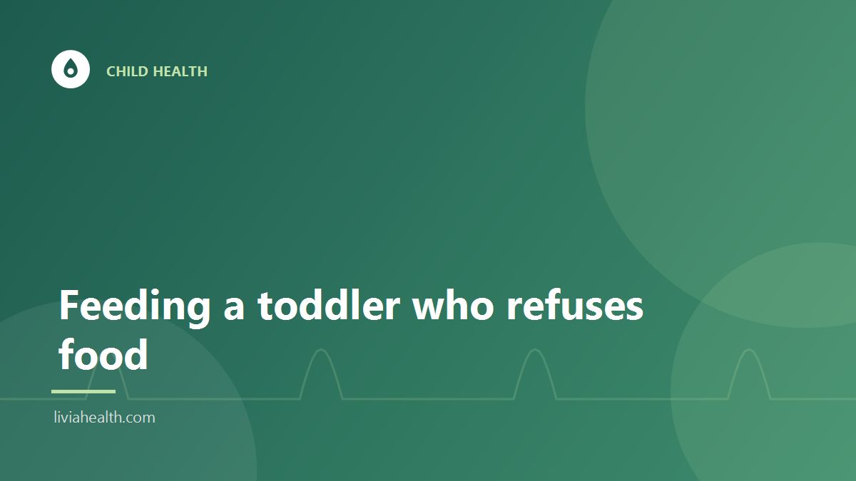 Toddler sitting at a table with a bowl of food